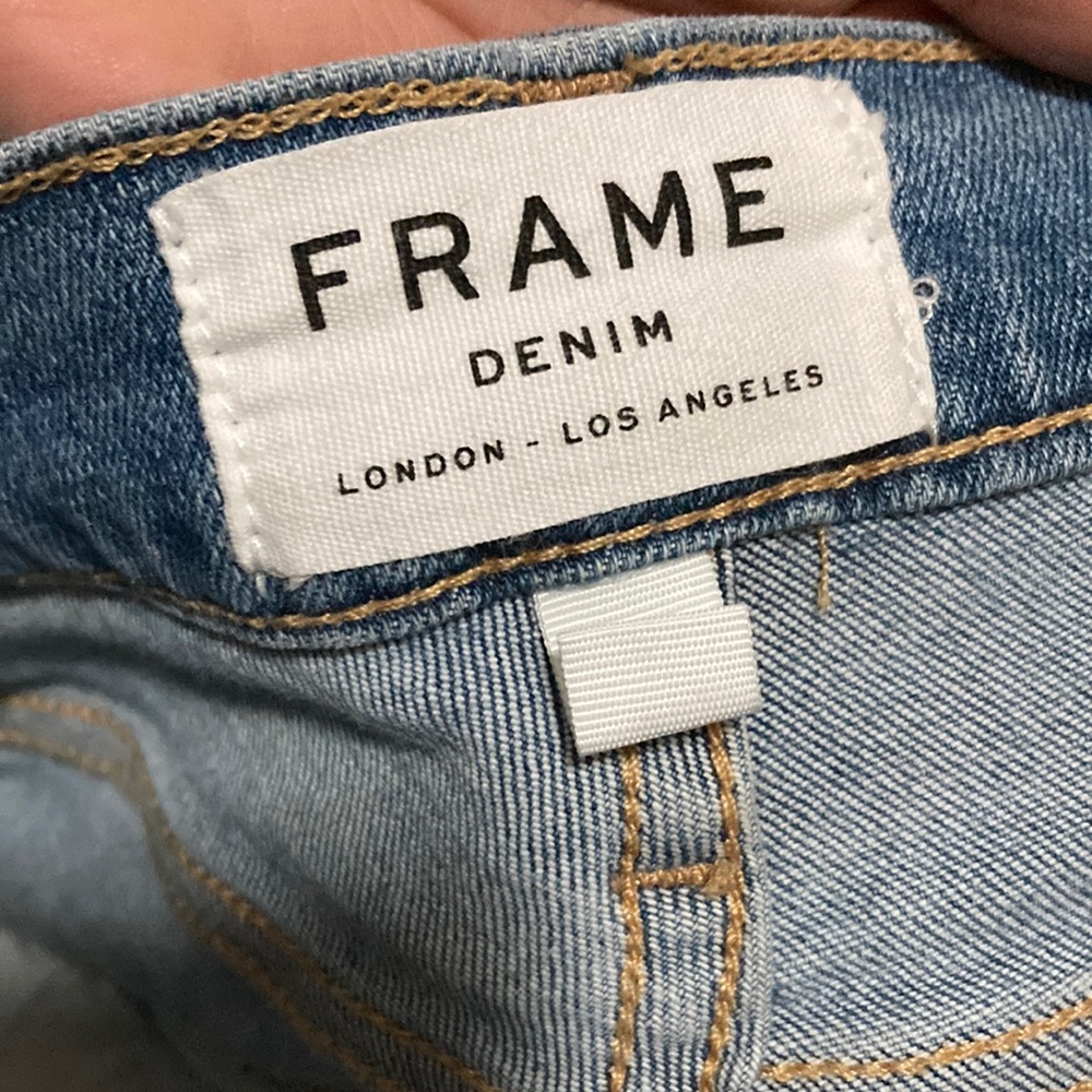 Frame skinny jeans with distressed hem